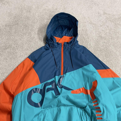 Oakley technical windbreaker jacket colour block paneled blue orange pull over half zip y2k