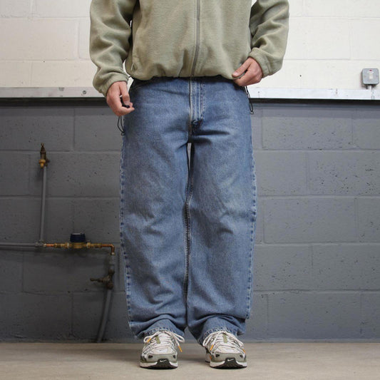 Vintage Y2K Levi’s 550 jeans blue W38L30 Loose straight leg 00s style denim pants red tab logo