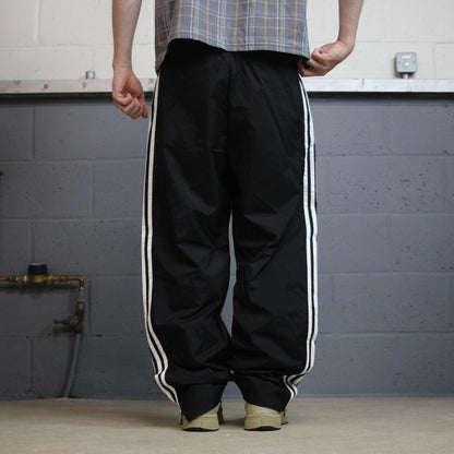 Y2K Adidas tracksuit bottoms black Medium Embroidered side stripe lined track pants