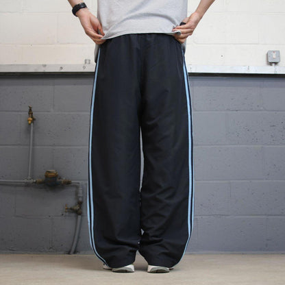 Vintage Womens navy Adidas joggers 22 y2k style sportswear track pants side stripe design