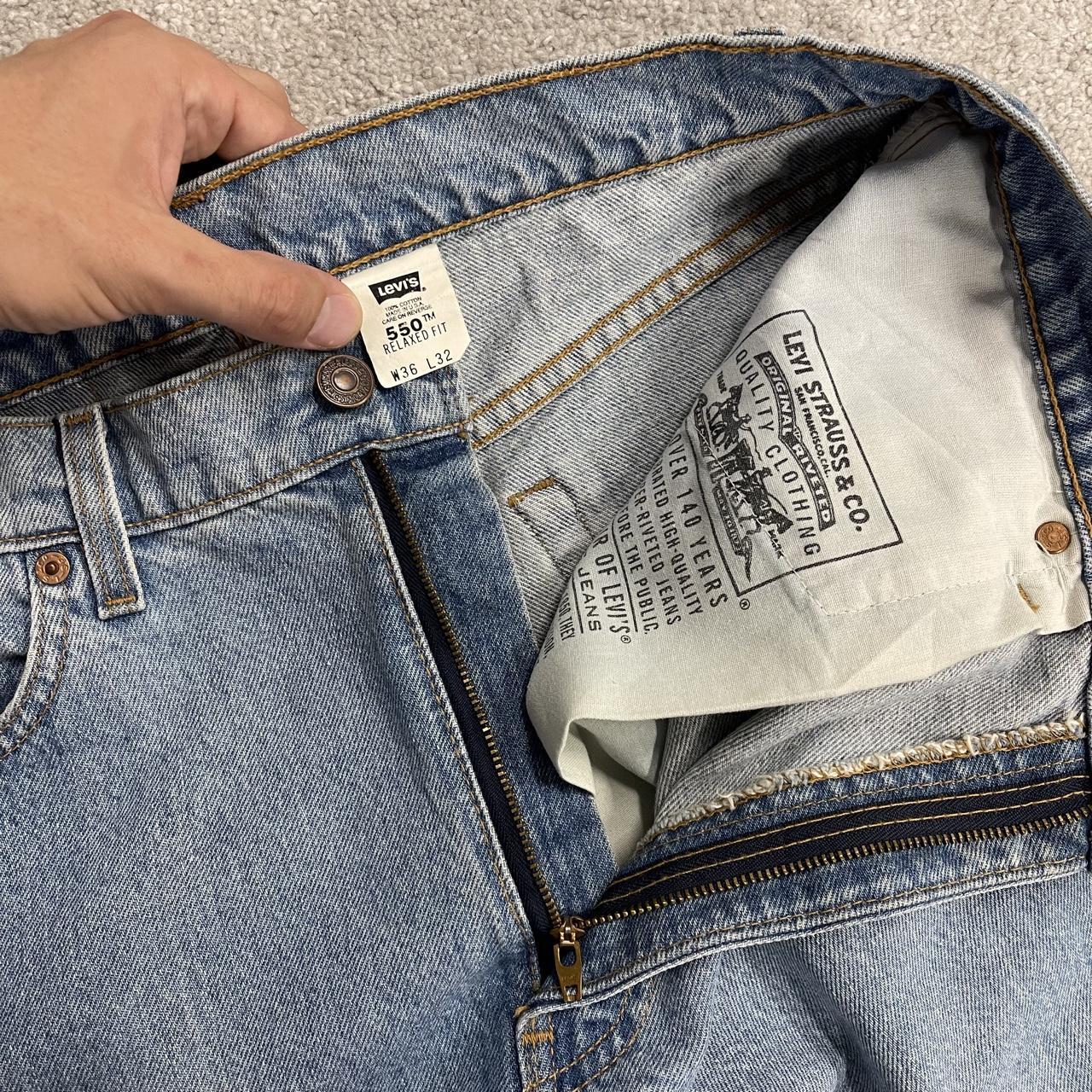 Vintage Levi’s baggy jeans y2k W34L32 washed blue Levi’s 550 relaxed fit surf style pants red tab