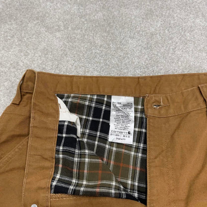 Vintage baggy Carhartt carpenter jeans tan 90s skater style W34L32 flannel lined carpenters